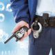 Midsection of security guard holding radio